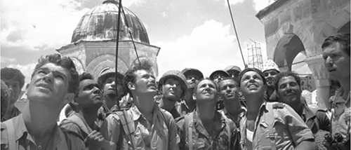 black and white image of soldiers looking at sky